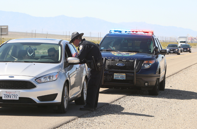 Nevada Highway Patrol trooper Jason Buratczuk talks to a driver who was pulled over for speeding on I-15 North in Jean on Friday, May 27, 2016. The Nevada Highway Patrol and California Highway Pat ...