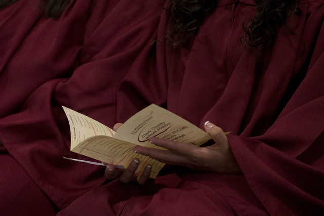 An inmate pages though the program during Florence McClure Women's Correctional Center's graduation ceremony in Las Vegas on May 25, 2016. (Bridget Bennett/Las Vegas Review-Journal) Follow @bridge ...