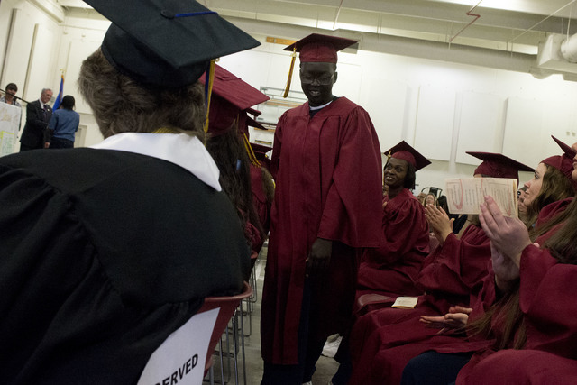 Inmate Nyakueth Tear walks up to receive her high school diploma during Florence McClure Women's Correctional Center's graduation ceremony in Las Vegas on May 25, 2016. (Bridget Bennett/Las Vegas  ...