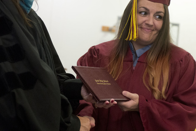 Inmate Jennifer Patrick receives her high school diploma during Florence McClure Women's Correctional Center's graduation ceremony in Las Vegas on May 25, 2016. (Bridget Bennett/Las Vegas Review-J ...