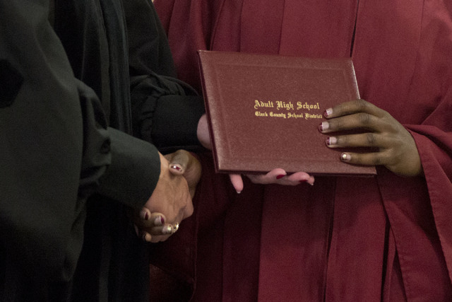 An inmate displays her high school diploma during Florence McClure Women's Correctional Center's graduation ceremony in Las Vegas on May 25, 2016. (Bridget Bennett/Las Vegas Review-Journal) Follow ...