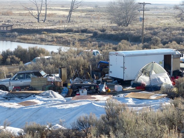 Vehicles, debris, and supplies remain Friday, Feb. 26, 2016, at what's left of Camp Finicum, the crude encampment used by the last four occupiers of the 41-day takeover of the Malheur National Wil ...
