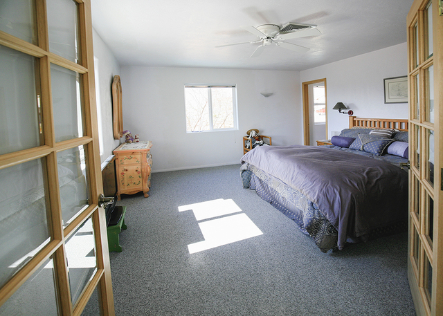 One of four master bedrooms in the Bonnie Springs home. (ELKE COTE/MILLIONS)
