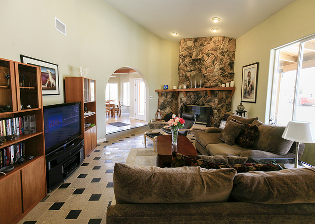 The living room of the Bonnie Springs house has a stone fireplace. (ELKE COTE/MILLIONS)