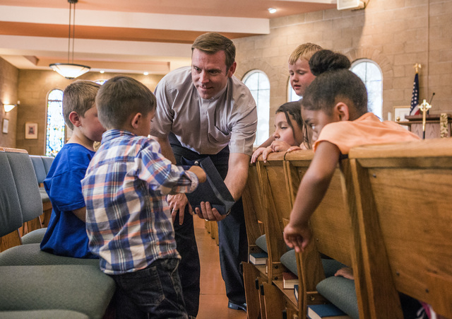 Rev. Michael Engfer performs a magic act with students at All Saints Episcopal Church, 4201 W. Washington Ave., on Wednesday, May 4,2016. Engfer, serves both All Saints Episcopal Church and the A ...
