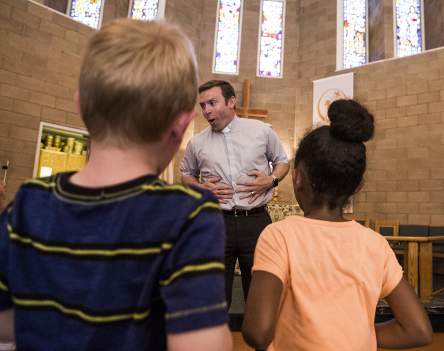 Rev. Michael Engfer performs a song with students at All Saints Episcopal Church, 4201 W. Washington Ave., on Wednesday, May 4,2016. Engfer, serves both All Saints Episcopal Church and the Air For ...