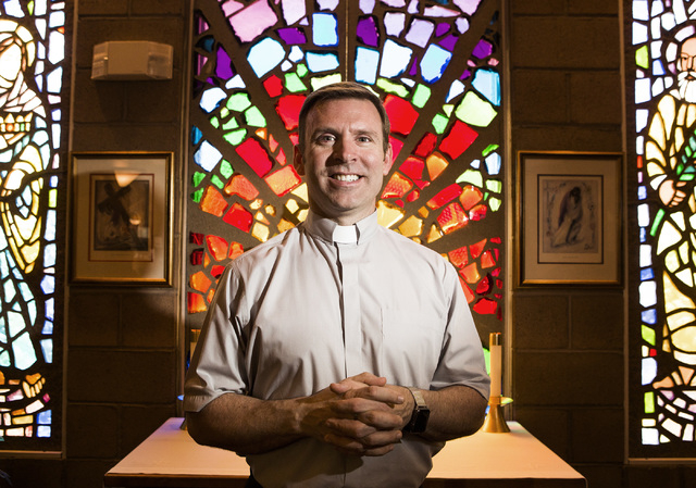 Rev. Michael Engfer stands beside a stain glass window at  All Saints Episcopal Church, 4201 W. Washington Ave., on Wednesday, May 4,2016. Engfer, serves both All Saints Episcopal Church and the A ...