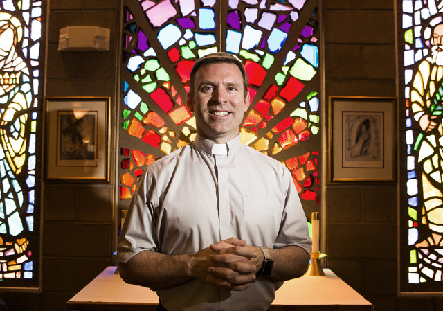 Rev. Michael Engfer stands beside a stain glass window at All Saints Episcopal Church, 4201 W. Washington Ave., on Wednesday, May 4,2016. Engfer, serves both All Saints Episcopal Church and the A ...