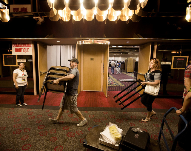People carry items during the liquidation sale at the closed Riviera hotel-casino, 2901 South Las Vegas Boulevard Wednesday, May 13, 2015. (Jeff Scheid/Las Vegas Review-Journal) Follow Jeff Scheid ...