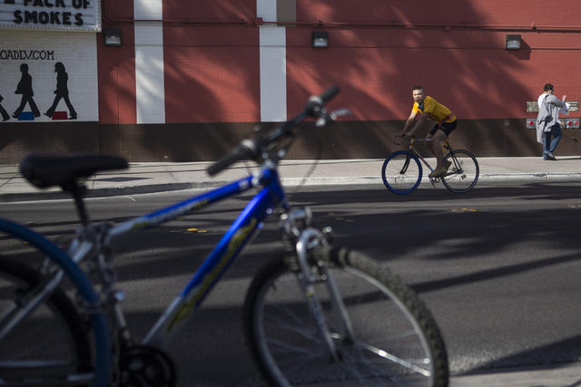 A bicyclist rides near Fremont Street and 7th Street on Tuesday, May 24, 2016, in Las Vegas. (Erik Verduzco/Las Vegas Review-Journal Follow @Erik_Verduzco)