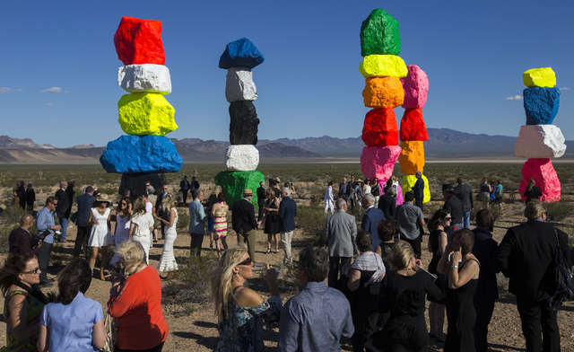 Over 200 people from around the country attended the ribbon cutting ceremony for the Seven Magic Mountains art project, Monday, May 9, 2016, near Jean Dry Lake, Nevada. The project is the work of  ...