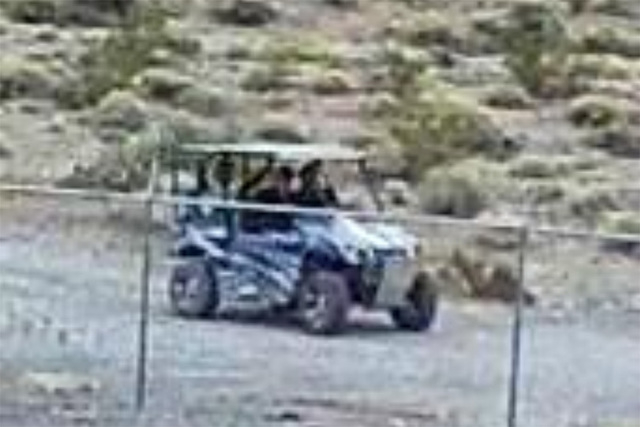 A security camera at Devils Hole took this image of three men in an off-road vehicle who are beileved to have damaged the endangered fish habitat 90 miles west of Las Vegas on April 30. (National  ...