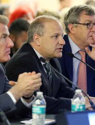 Marc Badain, president of the Oakland Raiders, center, speaks at a meeting of the Southern Nevada Tourism Infrastructure Committee at UNLV's Stan Fulton Building Thursday, May 26, 2016, in Las Veg ...