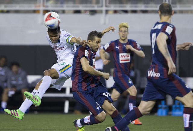 New York Cosmos' Jairo Arrieta (25) fights for possession with SD Eibar's Borja Ekiza (23) during a friendly between the New York Cosmos and SD Eibar, Wednesday, May 25, 2016, at Sam Boyd Stadium ...
