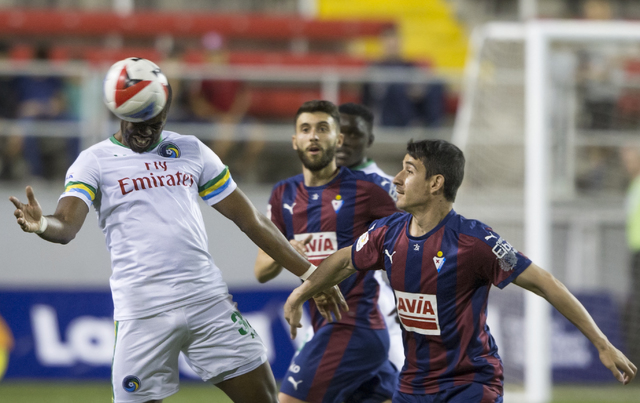 New York Cosmos defender Kwame Watson-Siriboe (32) heads a ball away from SD Eibar's Junca Rene (17) during a friendly between the New York Cosmos and SD Eibar, Wednesday, May 25, 2016, at Sam Boy ...