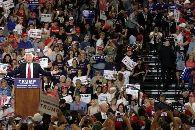 A protester (R) disrupts a rally with Republican U.S. presidential candidate Donald Trump and his supporters in Albuquerque, New Mexico, U.S. May 24, 2016. (Jonathan Ernst/Reuters)