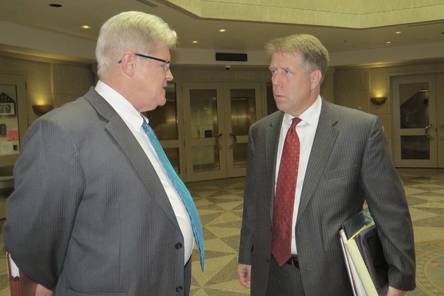 State Controller Ron Knecht, left, talks with attorney Craig Mueller outside the Nevada Supreme Court chambers on Monday, May, 2, in Carson City. Knecht is leading a referendum effort to repeal Ne ...