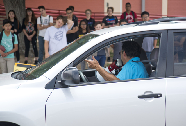 Driver's education instructor Mike Grady uses a loudspeaker as his teaches his students how to parallel park a car at Valley High School in Las Vegas on Friday, May 20, 2016. (Daniel Clark/Las Veg ...