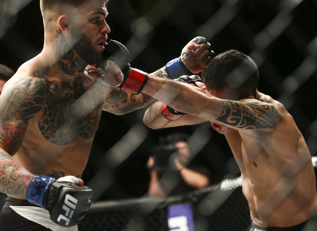 Cody Garbrandt, left, fights Thomas Almeida in their bantamweight bout during UFC Fight Night 88 at Mandalay Bay Events Center in Las Vegas on Sunday, May 29, 2016. Garbrandt won by first round kn ...
