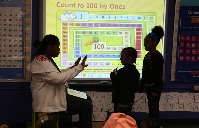 Neighborhood mom, Kiki Lee, teaches math to pre-K students at Kelly Elementary School Friday, April 29, 2016, in North Las Vegas. The Clark County School District recently removed and replaced the ...