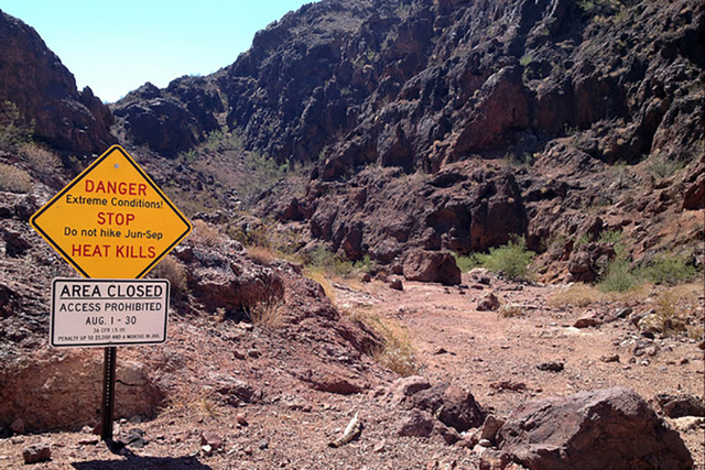A temporary closure sign for Goldstrike Canyon and Arizona Hot Spring (White Rock/Liberty Bell Arch) trails in Lake Mead National Recreation Area in shown in this August 2014 photo. (National Park ...