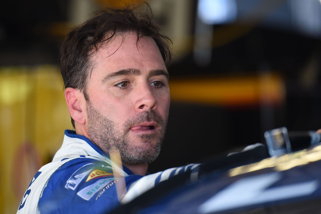 Jimmie Johnson prepares to go back out on the track during Sprint Cup Series afternoon practice at Kansas Speedway in Kansas City, Kan., Friday, May 6, 2016. (AP Photo/Reed Hoffmann)