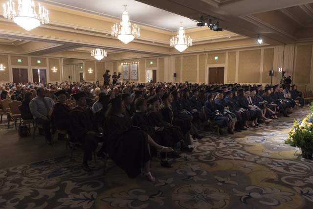 WSU Nevada graduates and their families listen as Nevada Lt. Gov. Mark Hutchison delivers commencement address during the school's first commencement ceremony at Hilton Lake Las Vegas Resort & ...