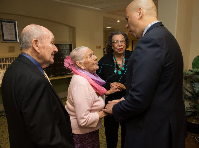 U.S. Sen. Cory Booker, right, greets guests alongside his mother, Carolyn, center, during a May 7, 2016, Mother's Day-themed event at Las Ventanas in Summerlin. Richard Brian/Special to View