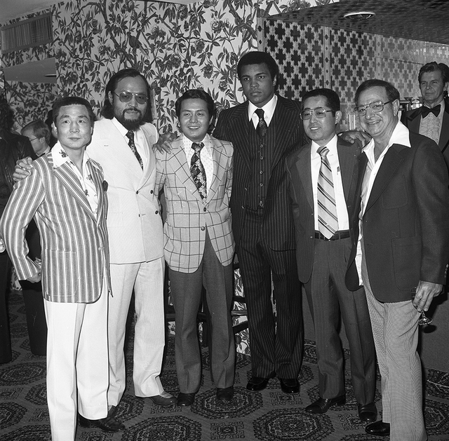 Muhammad Ali poses with guests at the Las Vegas Hilton Feb. 7, 1978. (Las Vegas News Bureau)