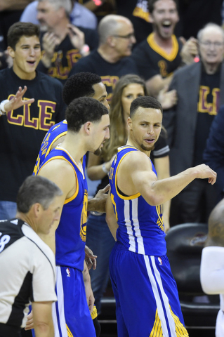 Golden State Warriors guard Stephen Curry (30) reacts after fouling out of the game in the fourth quarter of game six of the NBA Finals against the Cleveland Cavaliers at Quicken Loans Arena in Cl ...