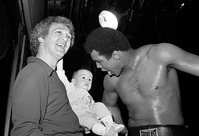 Muhammad Ali jokes with a baby during a work out for his fight against Ron Lyle May 12, 1975 at the Tropicana in Las Vegas. (Las Vegas News Bureau)