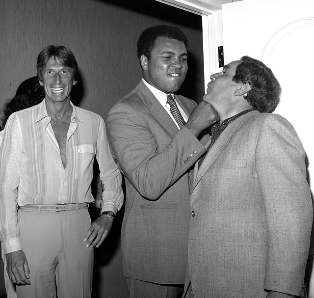 Muhammad Ali jokes with a guest as comedian David Brenner stands by at Caesars Palace Sept. 16, 1981. (Las Vegas News Bureau)
