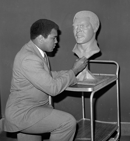 Muhammad Ali adds his signature to a bust of himself at Caesars Palace Sept. 17, 1981. (Las Vegas News Bureau)
