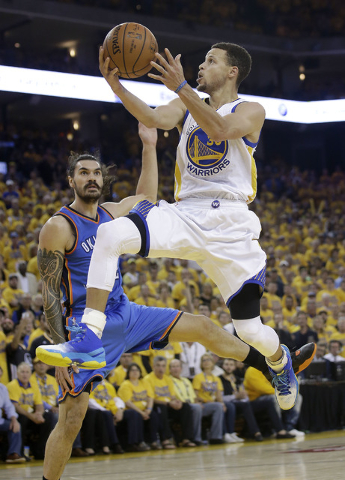 Golden State Warriors guard Stephen Curry (30) shoots against Oklahoma City Thunder center Steven Adams during the second half of Game 7 of the NBA basketball Western Conference finals in Oakland, ...