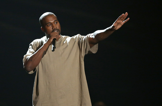 Kanye West accepts the video vanguard award at the MTV Video Music Awards at the Microsoft Theater in Los Angeles,  Aug. 30, 2015. (Matt Sayles/Invision/AP)