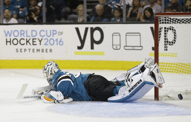 San Jose Sharks' Martin Jones dives but cant stop a goal shot by Pittsburgh Penguins' Ian Cole during the first period of Game 4 of the NHL hockey Stanley Cup Finals, Monday, June 6, 2016, in San  ...