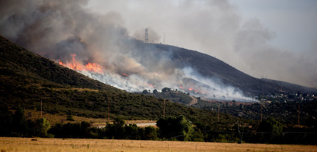 A brush fire in Yarnell, Ariz., Wednesday, June 8, 2016. threatened structures. Yarnell was the scene of a 2013 wildfire in which 19 members of an elite firefighting crew were killed. (Les Stuken ...