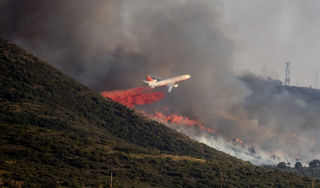 A brush fire burns in Yarnell, Ariz., Wednesday, June 8, 2016, threatening structures in the north-central Arizona town, the scene of a 2013 wildfire in which 19 members of an elite firefighting c ...