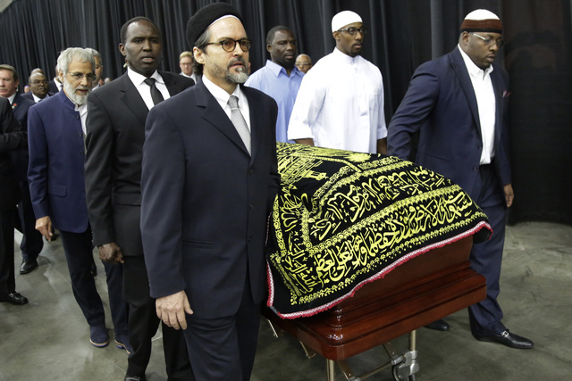 Muhammad Ali's casket is escorted by pallbearers for his Jenazah, a traditional Islamic Muslim service, in Freedom Hall, Thursday, June 9, 2016, in Louisville, Ky. (AP Photo/David Goldman)