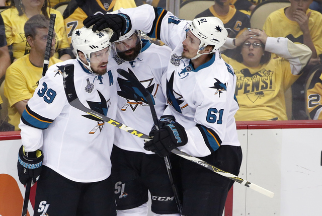 San Jose Sharks' Logan Couture (39) celebrates his goal against the Pittsburgh Penguins with teammates during the first period in Game 5 of the NHL hockey Stanley Cup Finals on Thursday, June 9, 2 ...
