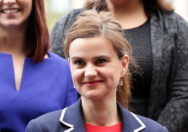 In this May 12, 2015 photo, Labour Member of Parliament Jo Cox poses for a photograph. The British lawmaker was killed in a shooting and stabbing incident near Leeds, in West Yorkshire, England, T ...