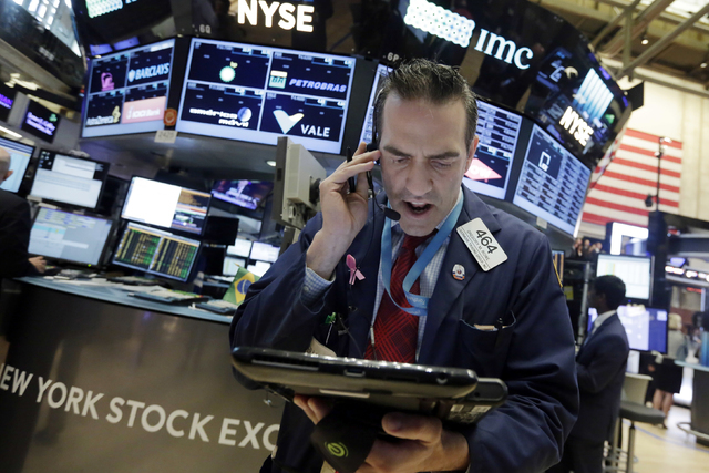 Trader Gregory Rowe works on the floor of the New York Stock Exchange, Monday, June 20, 2016. U.S. stocks are jumping Monday morning as investors grow more optimistic that Britain will remain in t ...