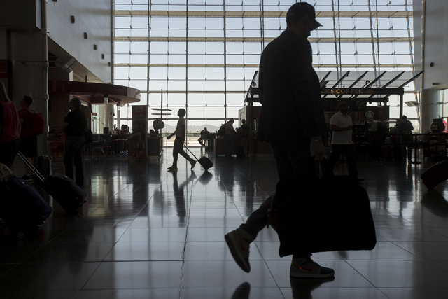 Travelers pass through McCarran International Airport in Las Vegas on June 7, 2016. (Bridget Bennett/Las Vegas Review-Journal) Follow @bridgetkbennett