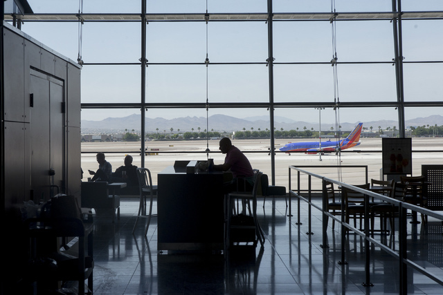 Travelers sit inside McCarran International Airport in Las Vegas on June 7, 2016. (Bridget Bennett/Las Vegas Review-Journal) Follow @bridgetkbennett