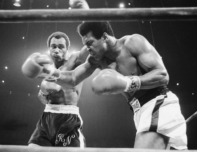 In this Sept. 10, 1973, file photo, Muhammad Ali, right, winces as Ken Norton hits him with a left to the head during their re-match at the Forum in Inglewood, Calif.  (AP Photo/File)