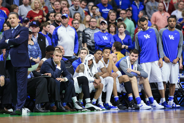 The Kentucky bench and coach John Calipari, left, follow the final seconds of a second-round men's college basketball game against Indiana in the NCAA Tournament in Des Moines, Iowa, Saturday, Mar ...