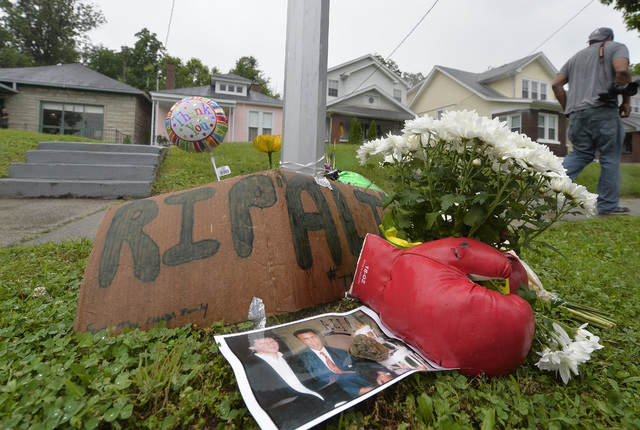 A small memorial sits in front of the boyhood home of Muhammad Ali on Saturday, June 4, 2016 in Louisville, Ky.  (Timothy D. Easley/The Associated Press)
