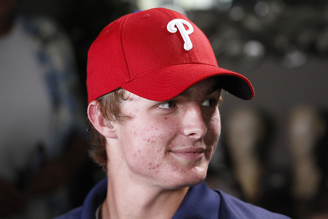 La Costa Canyon baseball player Mickey Moniak wears a Philadelphia Phillies cap just after it was announced that the Phillies had chosen Moniak with the top pick in the Major League Baseball draft ...