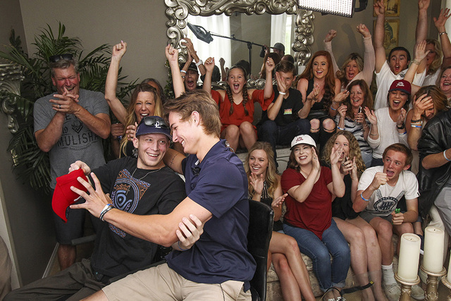 La Costa Canyon baseball player Mickey Moniak, front, hugs his cousin Tanner Gage as they, family members and friends celebrate after it was announced that the Philadelphia Phillies had chosen Mon ...