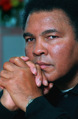 Boxing legend Muhammad Ali poses for a photo after an interview in New York, Tuesday Feb. 2, 1999. (Richard Drew/AP)